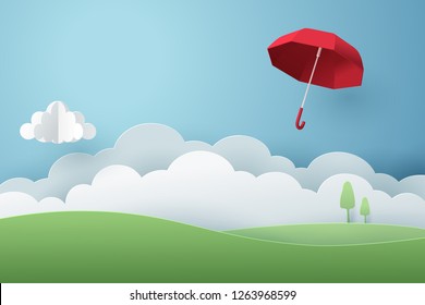 Paper art of red umbrella fly above the grass on the sky, vector art and illustration.