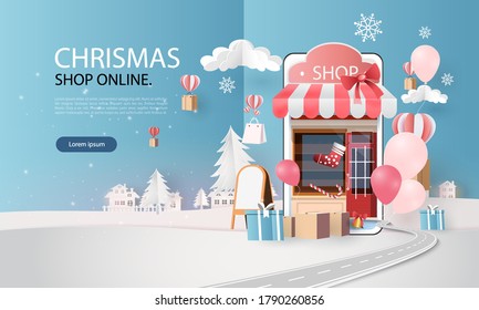 paper art shopping online on smart phone chrismas day and new year winter season 