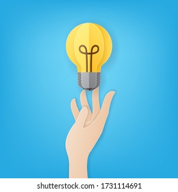 Paper art style of hand carrying light bulb on blue background, Idea creative concept, Vector illustration