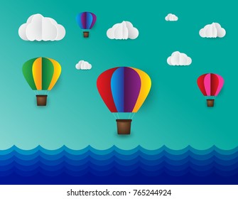 paper art style. Origami made colorful air balloon cloud. blue sky sea