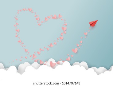 Paper art style of valentine's day greeting card with heart and love concept.Paper airplane and hearts shape Floating on cloud and blue sky.Vector illustration.