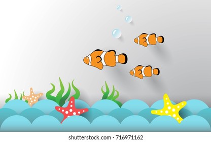 Paper art style.Fish and starfish on the ocean waves.Flat paper.