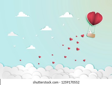 Paper art of Valentine Day Festival with White Cat in Paper Balloon Heart Shape Basket on The Blue Sky vector