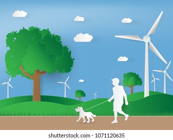paper art of wind turbine on green landscape. concept green energy in nature