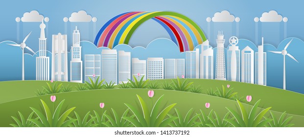 Paper art of world environment day concept with  skyscraper, wind turbine fields and rainbow