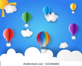 paper arts clouds, sun and hot baloon air flying on the blue sky. paper arts style