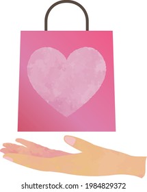 A paper bag for a heart-shaped gift on the palm of your hand