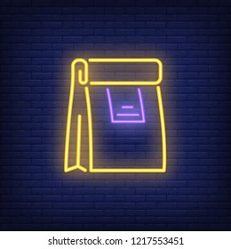 Paper bag neon sign. Glowing illustration of paper packet on dark blue brick background. Can be used for shops, cafe, fast food restaurant, deliveries, advertisement