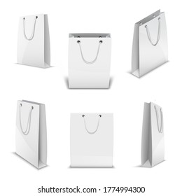 Paper bags for shopping realistic 3D vector templates set. White empty paper bags at various angles. Shop bag, great design for any purposes. 