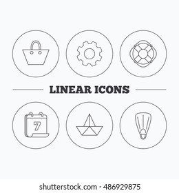 Paper boat, flippers and lifebuoy icons.