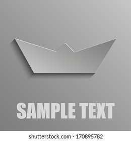 Paper boat on a gray background