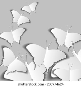 paper butterflies on a gray background