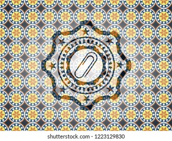 paper clip icon inside arabic badge. Arabesque decoration.