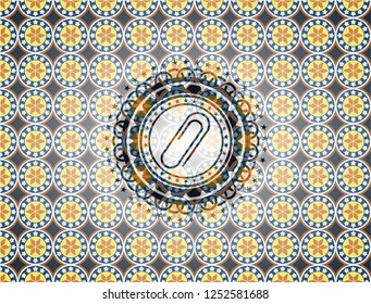 paper clip icon inside arabic emblem. Arabesque decoration.