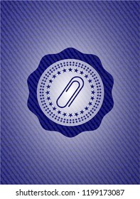 paper clip icon inside badge with jean texture