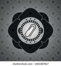 paper clip icon inside black emblem