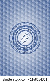 paper clip icon inside blue emblem or badge with abstract geometric pattern background.
