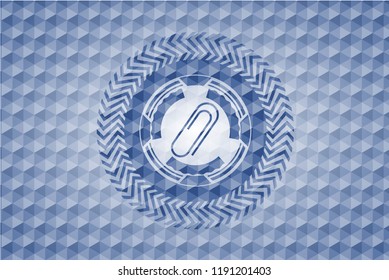 paper clip icon inside blue polygonal emblem.