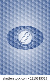 paper clip icon inside blue polygonal badge.