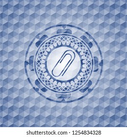 paper clip icon inside blue badge with geometric background.