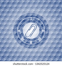 paper clip icon inside blue hexagon emblem.