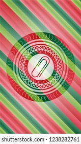paper clip icon inside christmas badge.