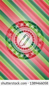 paper clip icon inside christmas style badge..
