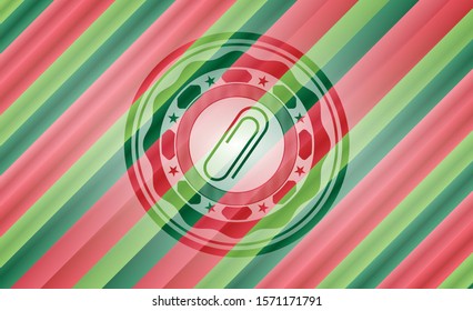 paper clip icon inside christmas emblem.