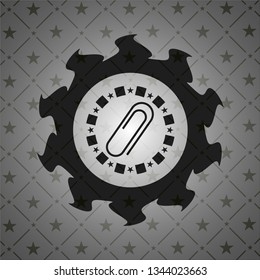 paper clip icon inside dark emblem