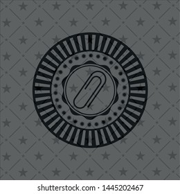 paper clip icon inside dark emblem