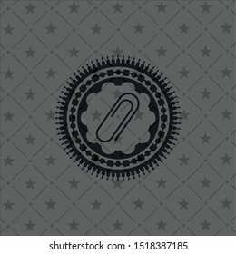 paper clip icon inside dark emblem