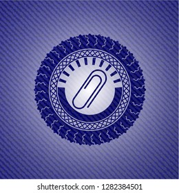 paper clip icon inside denim background