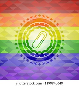 paper clip icon inside emblem on mosaic background with the colors of the LGBT flag