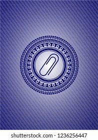 paper clip icon inside emblem with jean texture
