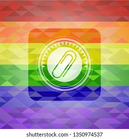 paper clip icon inside emblem on mosaic background with the colors of the LGBT flag