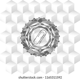 paper clip icon inside grey badge with geometric cube white background
