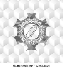 paper clip icon inside grey emblem with cube white background