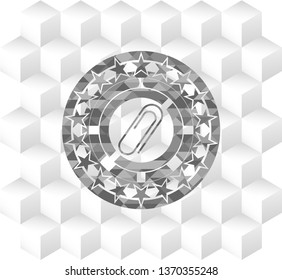 paper clip icon inside grey icon or emblem with geometric cube white background