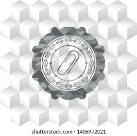paper clip icon inside grey badge with geometric cube white background