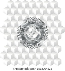 paper clip icon inside grey badge with geometric cube white background