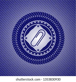 paper clip icon inside jean or denim emblem or badge background