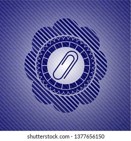 paper clip icon inside jean or denim emblem or badge background