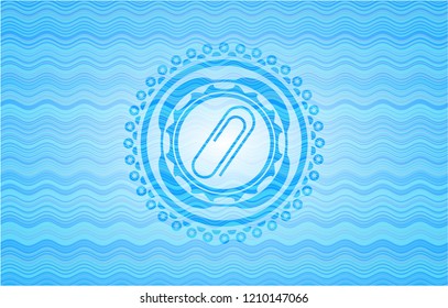 paper clip icon inside light blue water badge background.