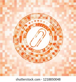 paper clip icon inside orange mosaic emblem
