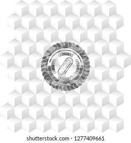 paper clip icon inside realistic grey emblem with cube white background