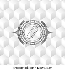 paper clip icon inside realistic grey emblem with cube white background