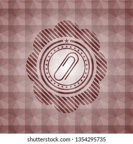 paper clip icon inside red seamless polygonal badge.