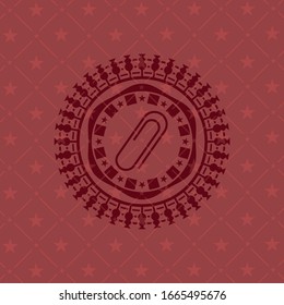 paper clip icon inside red icon or emblem