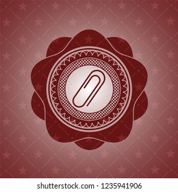 paper clip icon inside retro red emblem