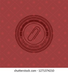 paper clip icon inside retro red emblem